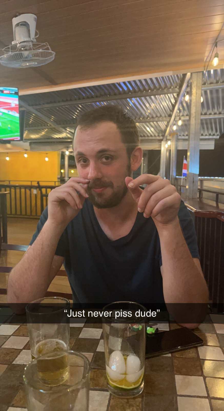A text message screenshot reading “Just never piss dude.”