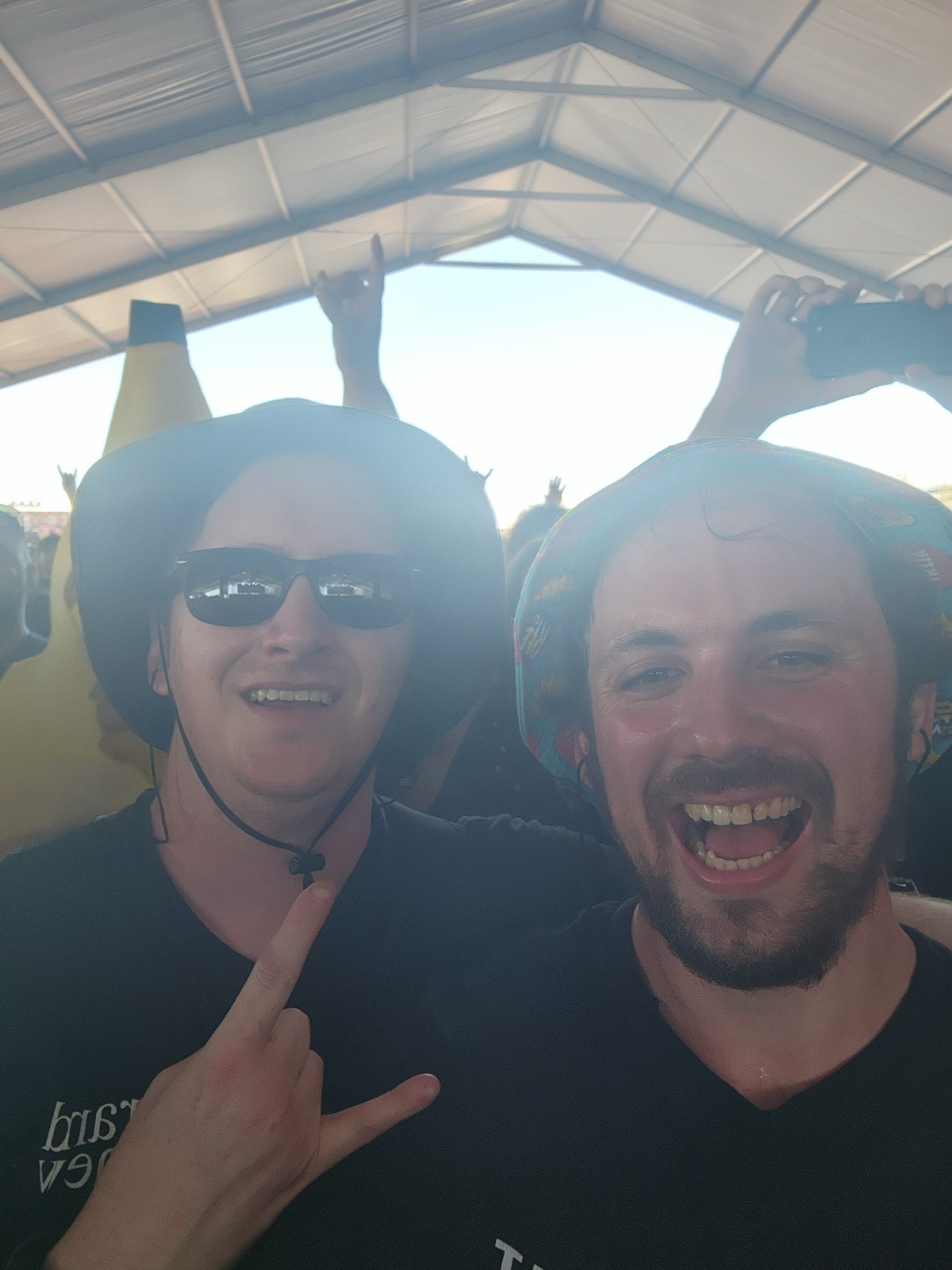 Matthew and Daniel at a concert, visibly tired and happy.