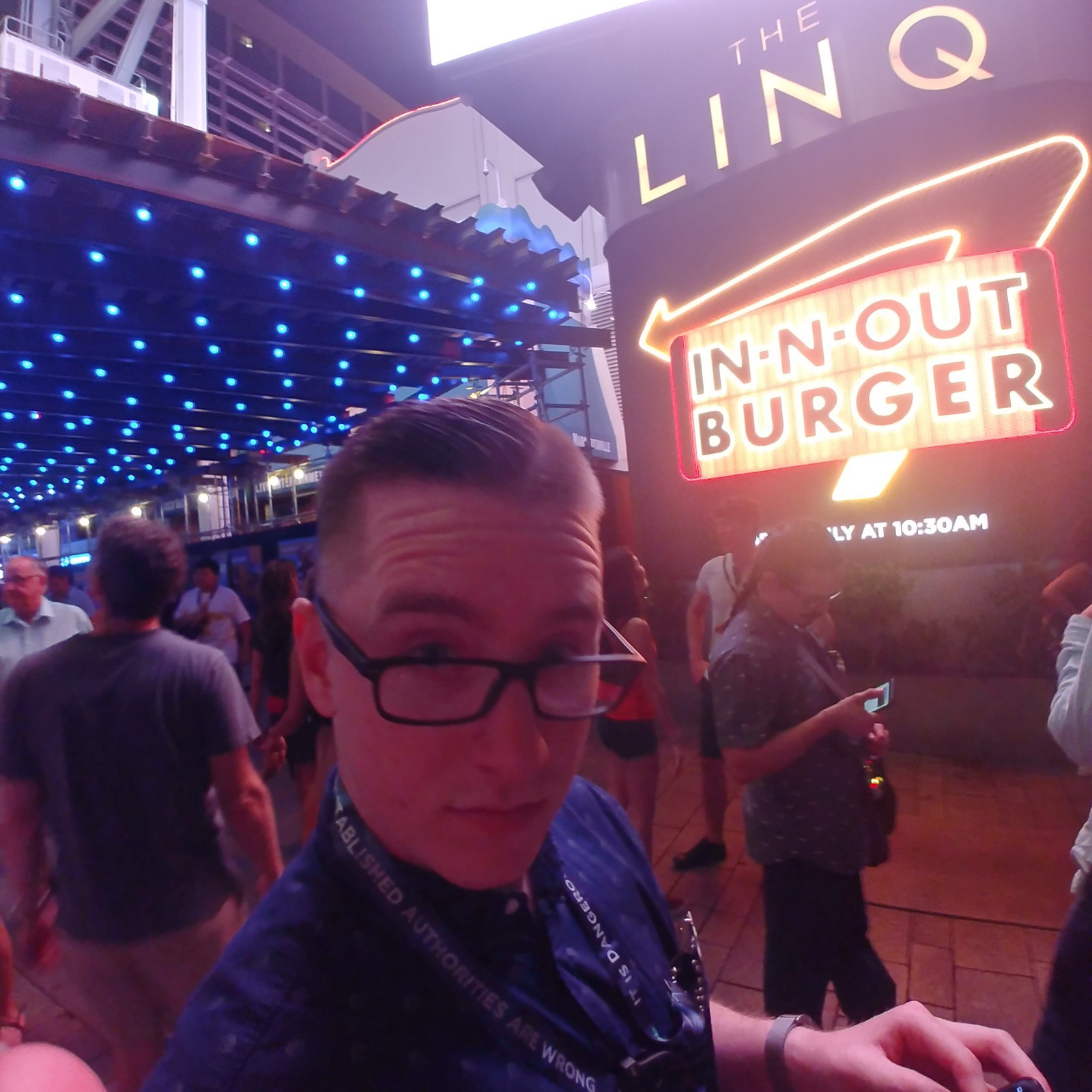 Matthew holding a burger at In-N-Out.